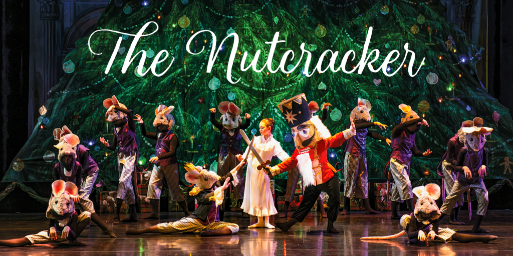 Nutcracker cast with tree in background